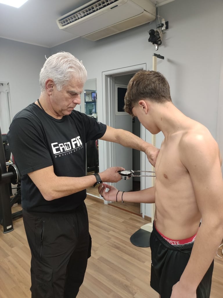 Fitness instructor measuring arm with calipers